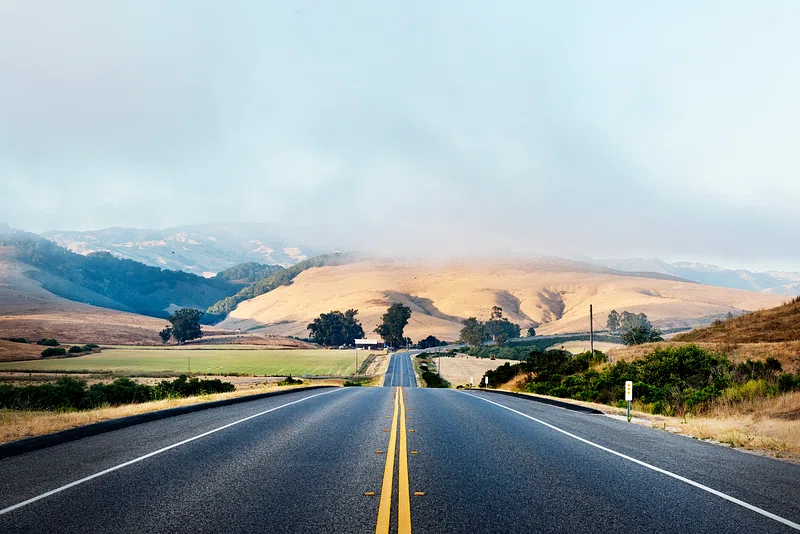 image of road stretching into mountain